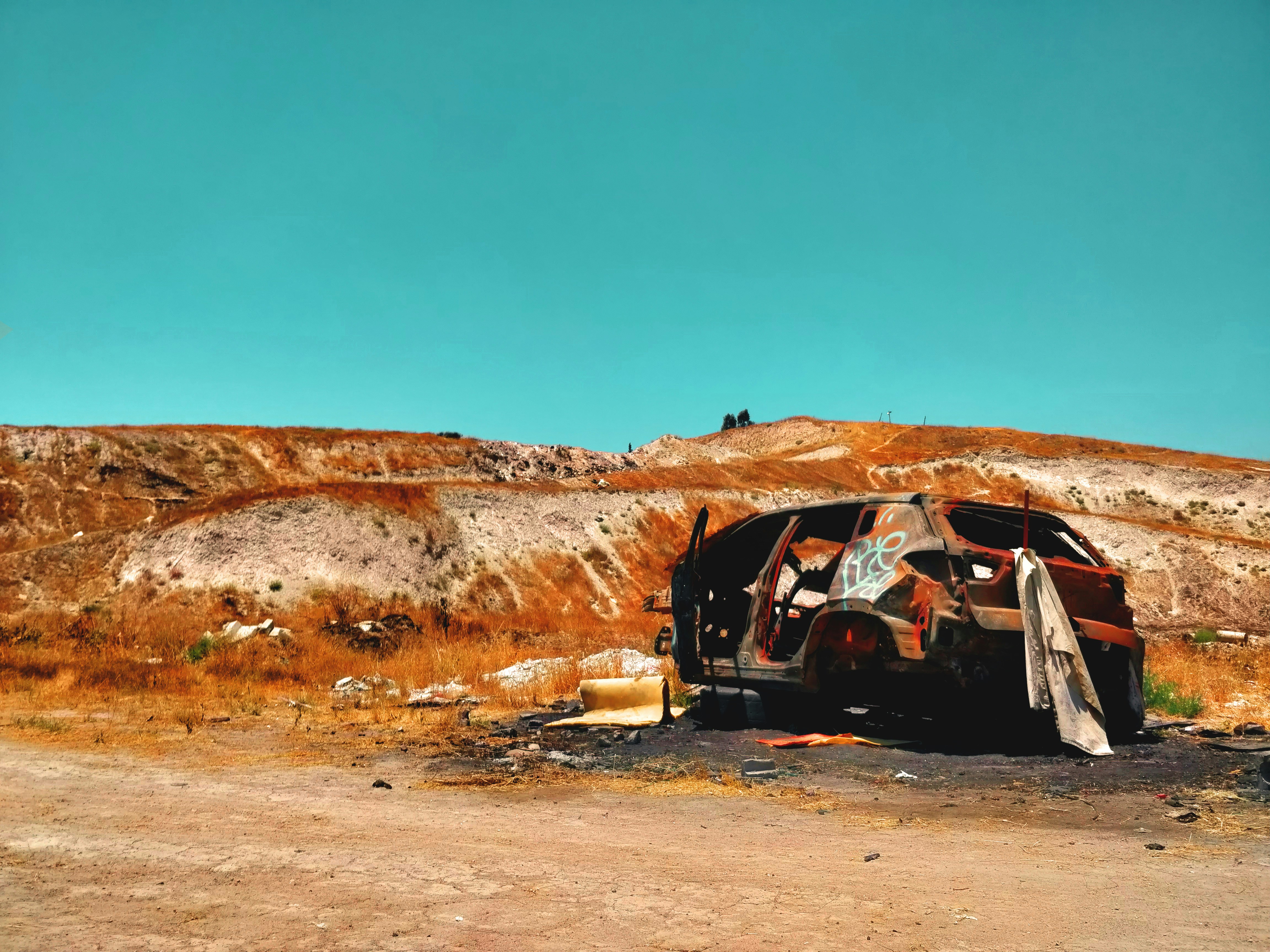 black suv on brown dirt road during daytime