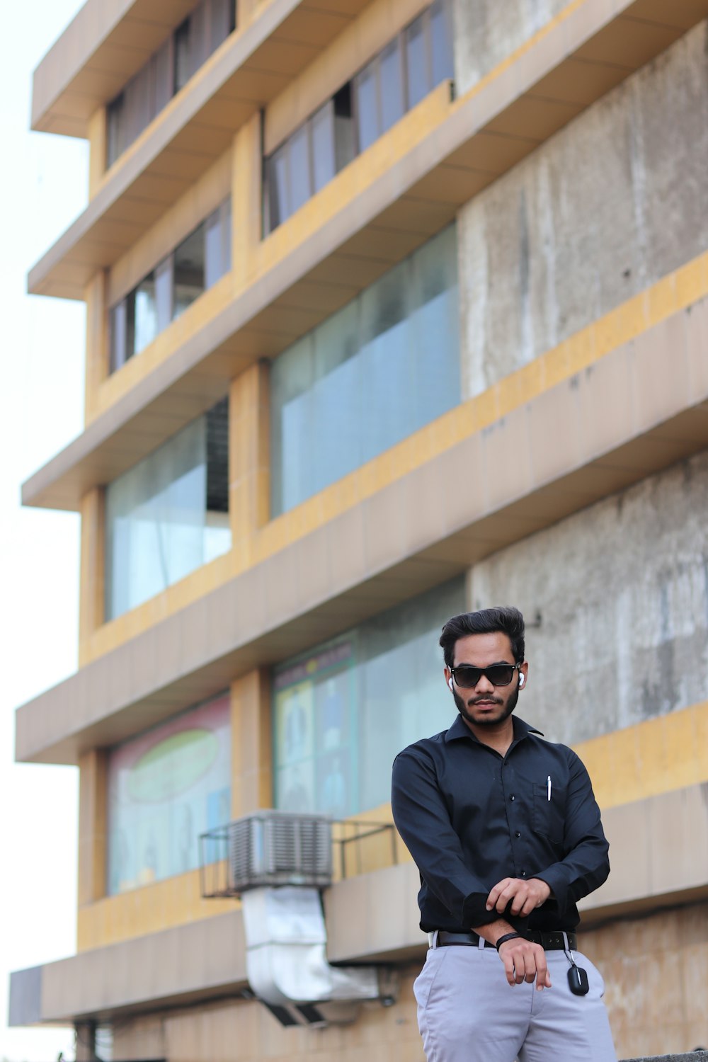 man in black jacket wearing black sunglasses