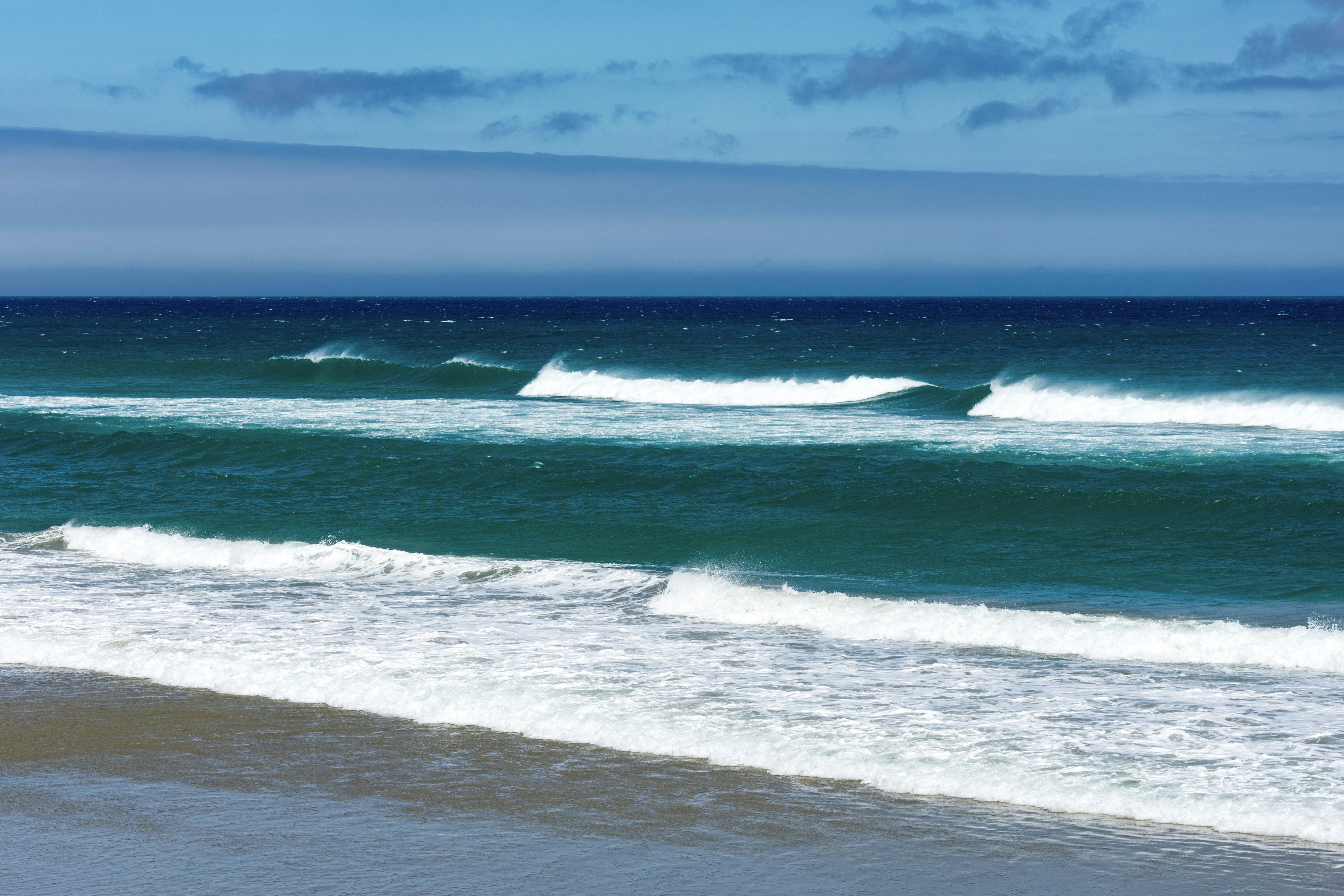 ocean waves crashing on shore during daytime, 