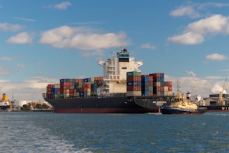 cargo ship on sea under blue sky during daytime