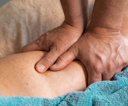 persons feet on blue towel