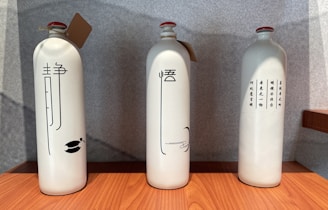 Close-up of traditional Chinese baijiu bottles displayed with elegant calligraphy labels