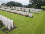 A row of pristine headstones gleaming after maintenance, with fresh flowers placed respectfully.
