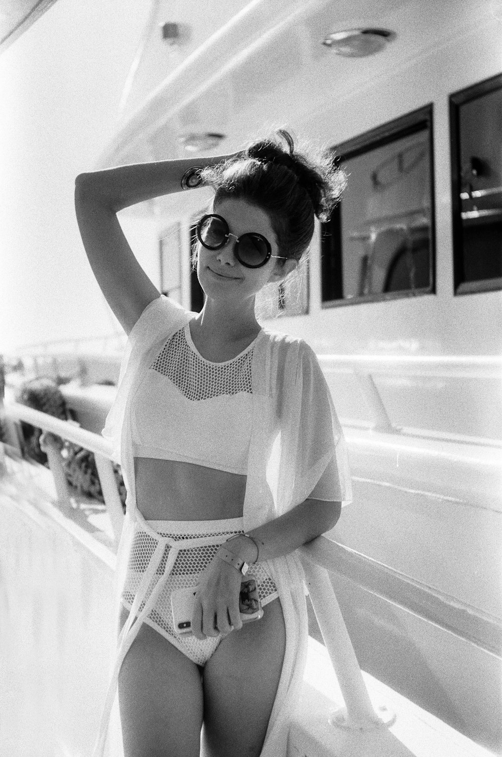 woman in white scoop neck shirt wearing sunglasses