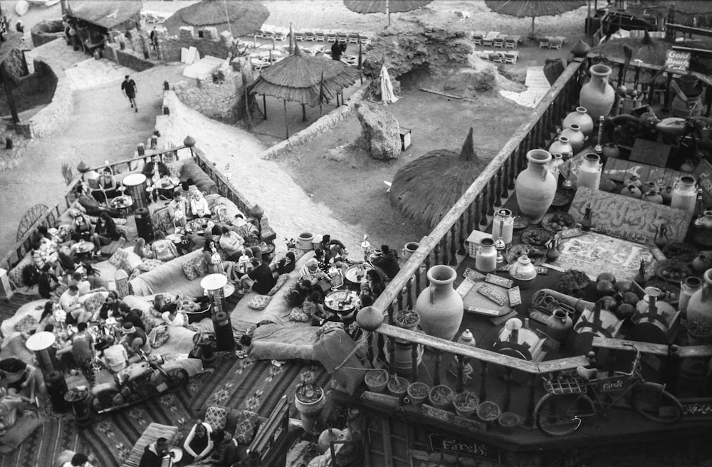 grayscale photo of people in a market