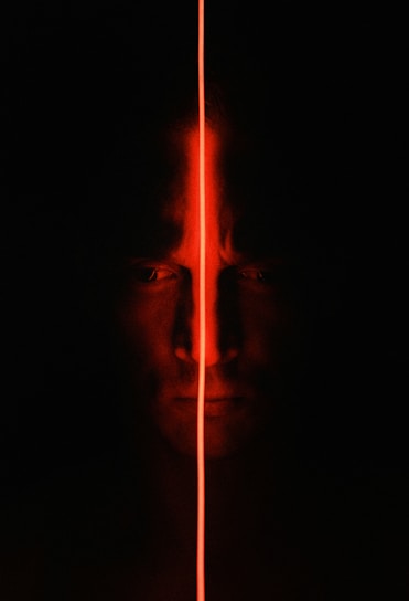 man with light in the dark