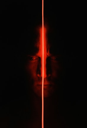 man with light in the dark