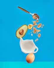 white ceramic mug with silver spoon