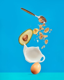 white ceramic mug with silver spoon