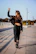 Dynamic shot of a woman rocking Solfury apparel on a sunlit Florida street corner.