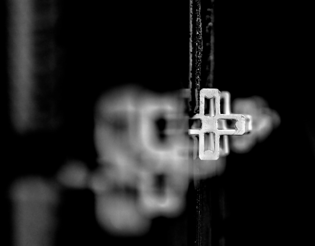 black and white cross with rope