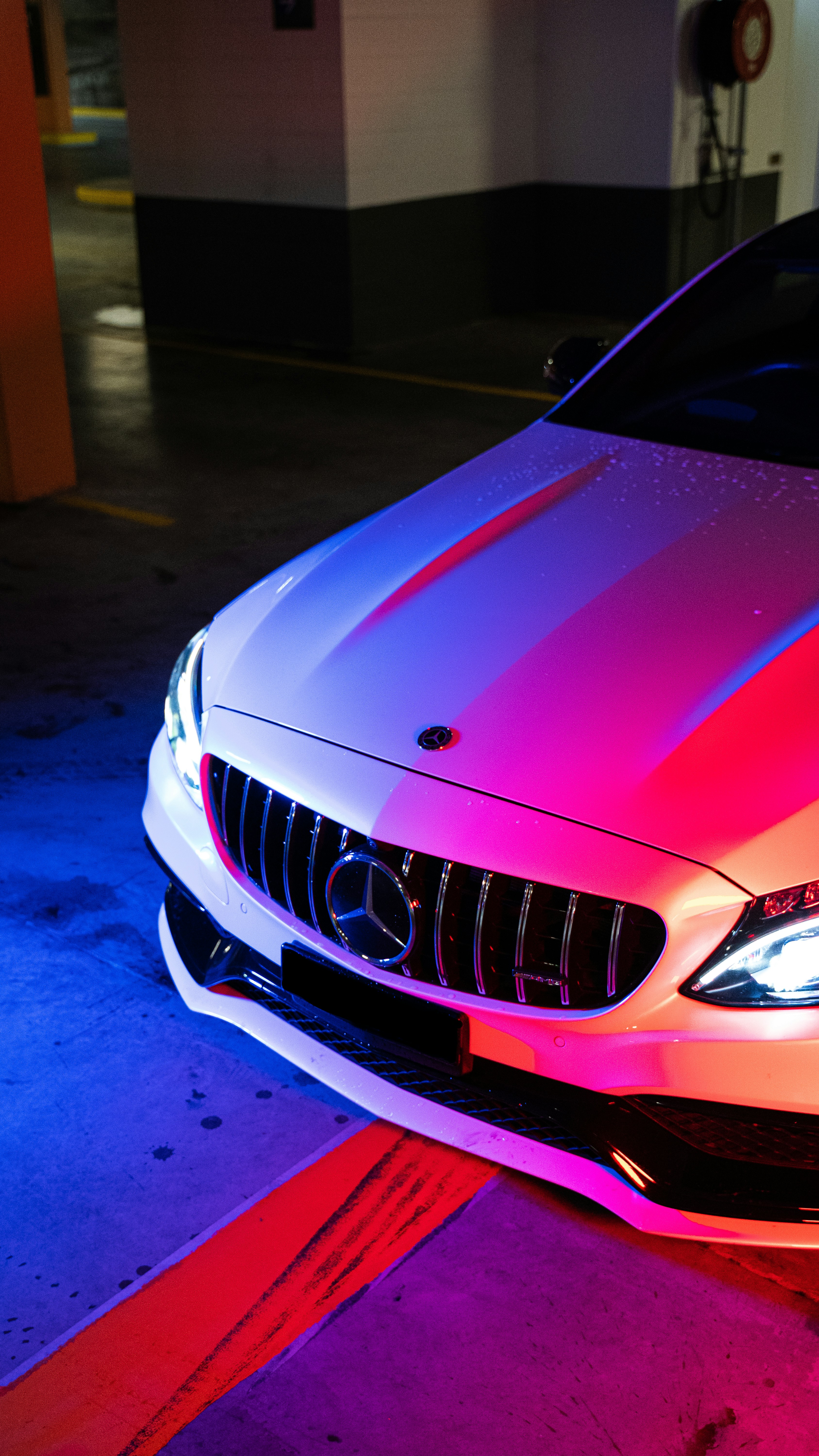 red bmw car on blue floor