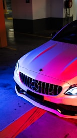 red bmw car on blue floor