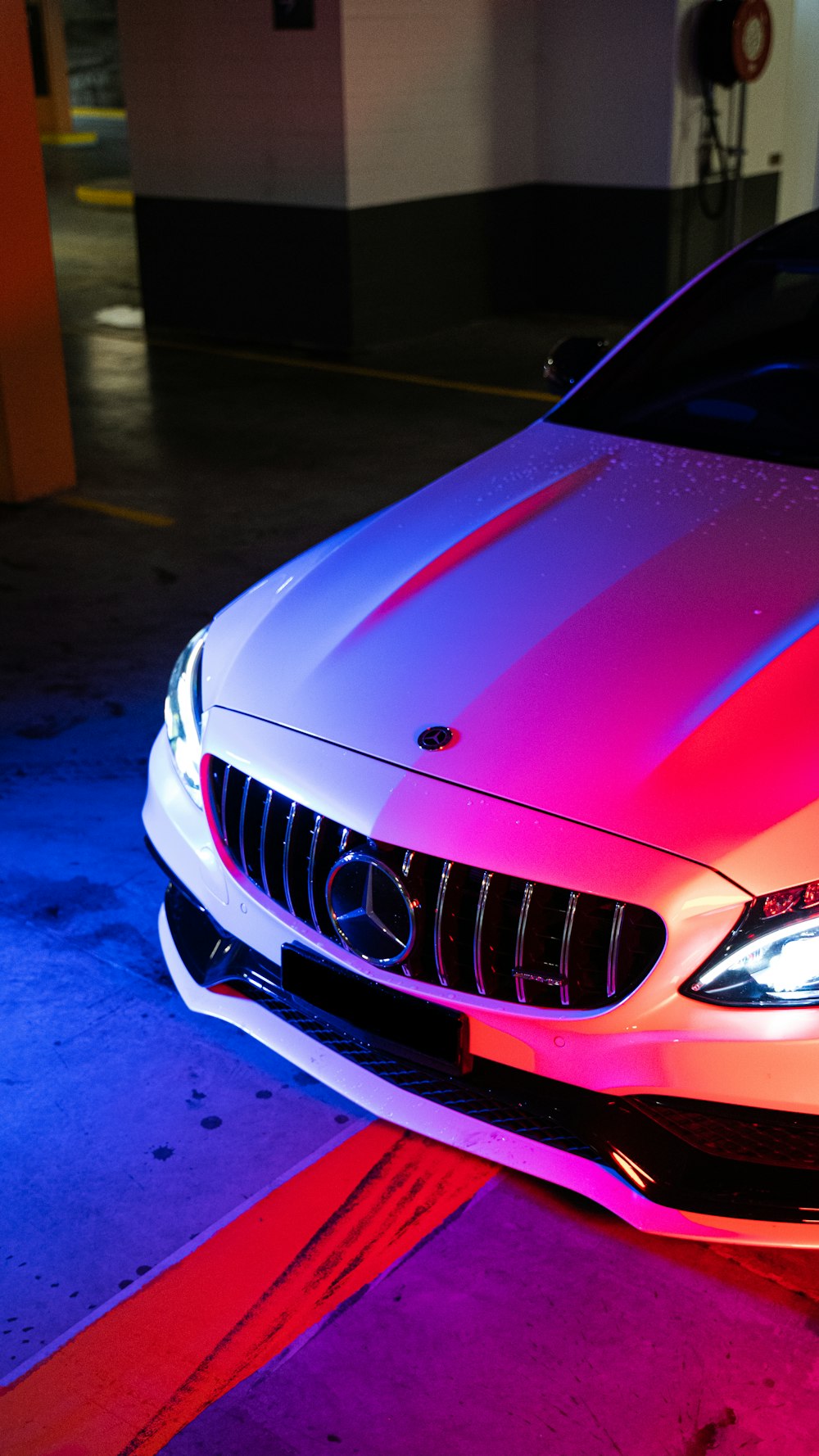 red bmw car on blue floor