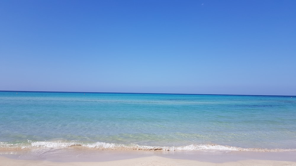 blue sea under blue sky during daytime