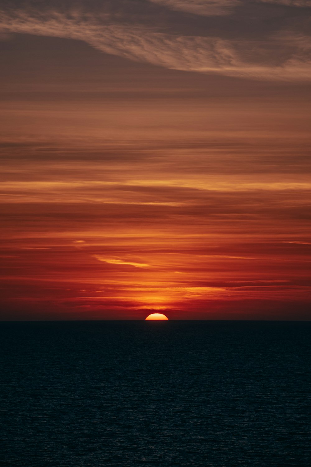 body of water during sunset