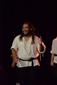 Portrait of a smiling artist performing on stage