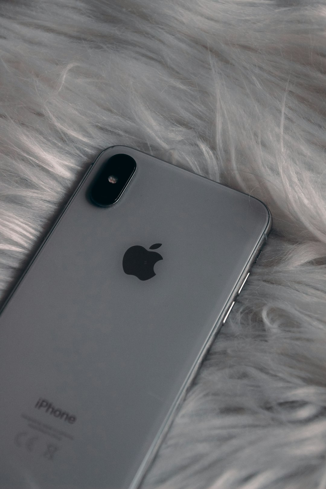 silver iphone 6 on white textile
