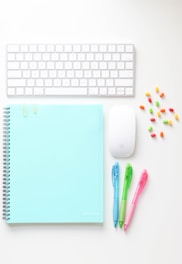 white apple keyboard beside white apple magic mouse