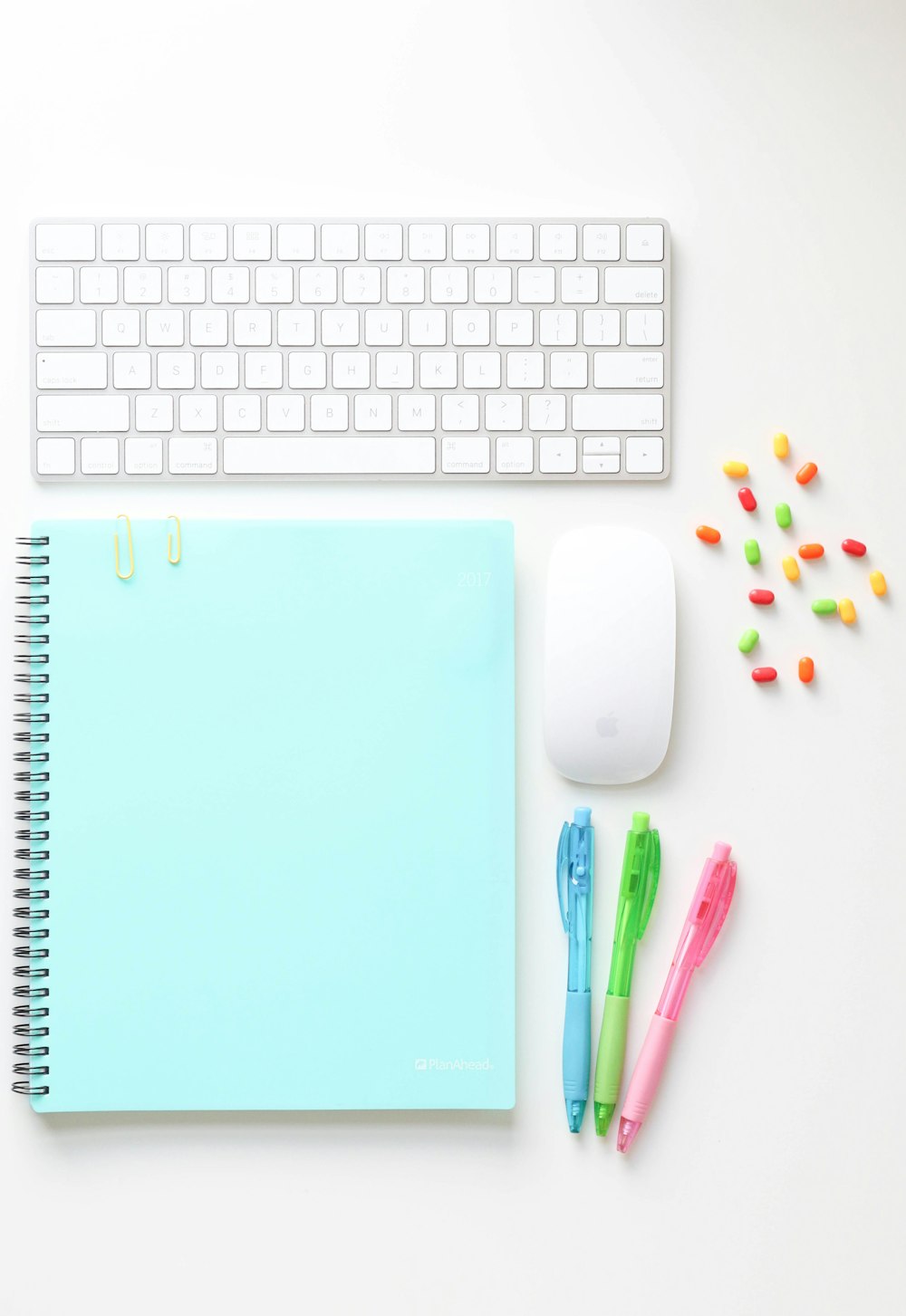 white apple keyboard beside white apple magic mouse