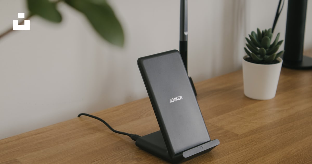 Black and gray rectangular device on brown wooden table photo – Free ...