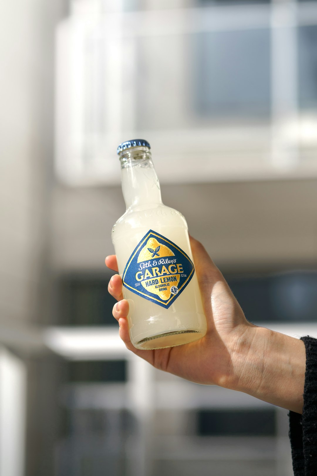 person holding kraft classic ranch bottle