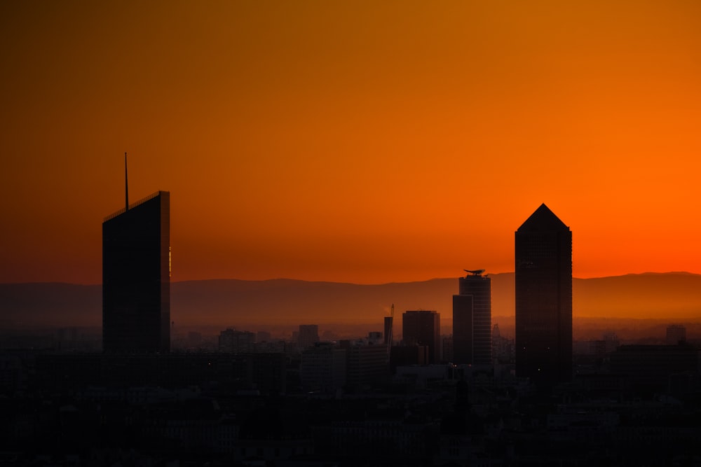 city skyline under blue sky during daytime