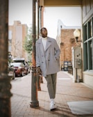 A stylish outfit laid out on a city street.