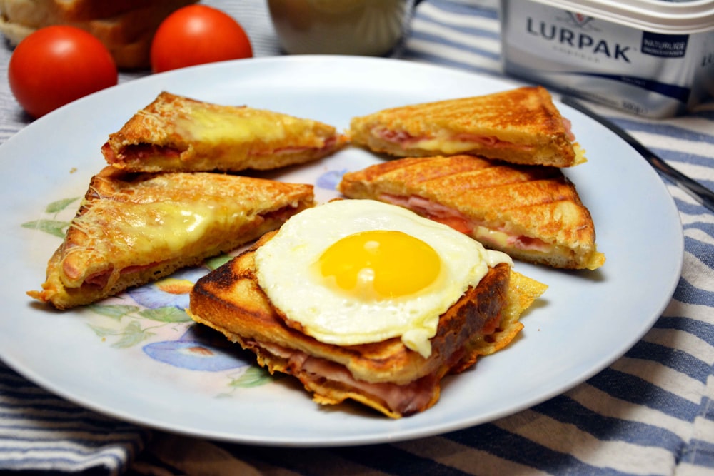 sunny side up egg on bread on white ceramic plate