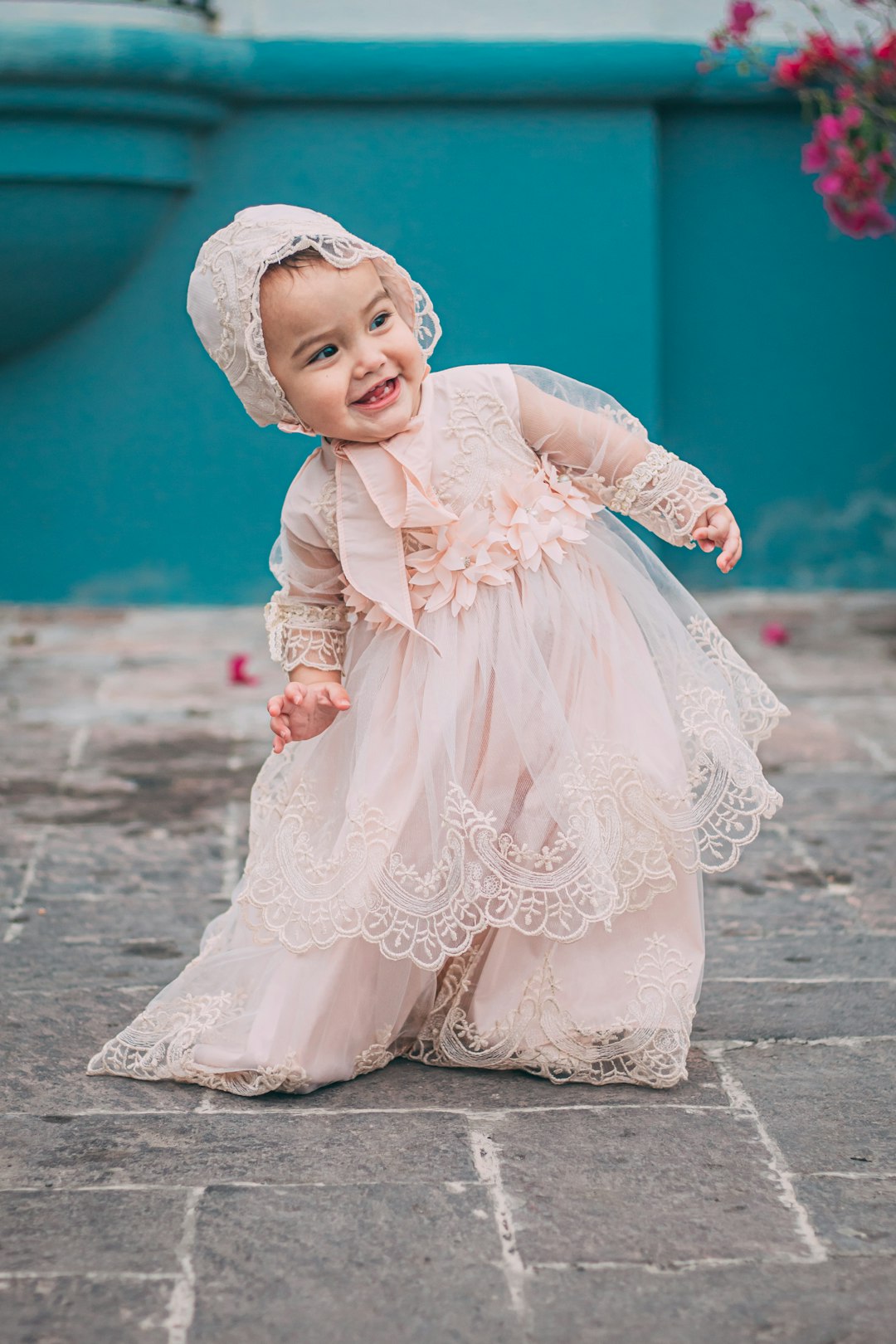 girl in pink dress and white floral hijab