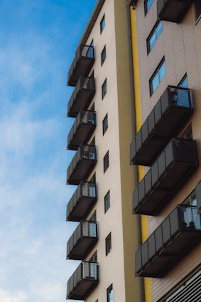 A cozy apartment building with balconies overlooking a quiet street in Andhra Pradesh.