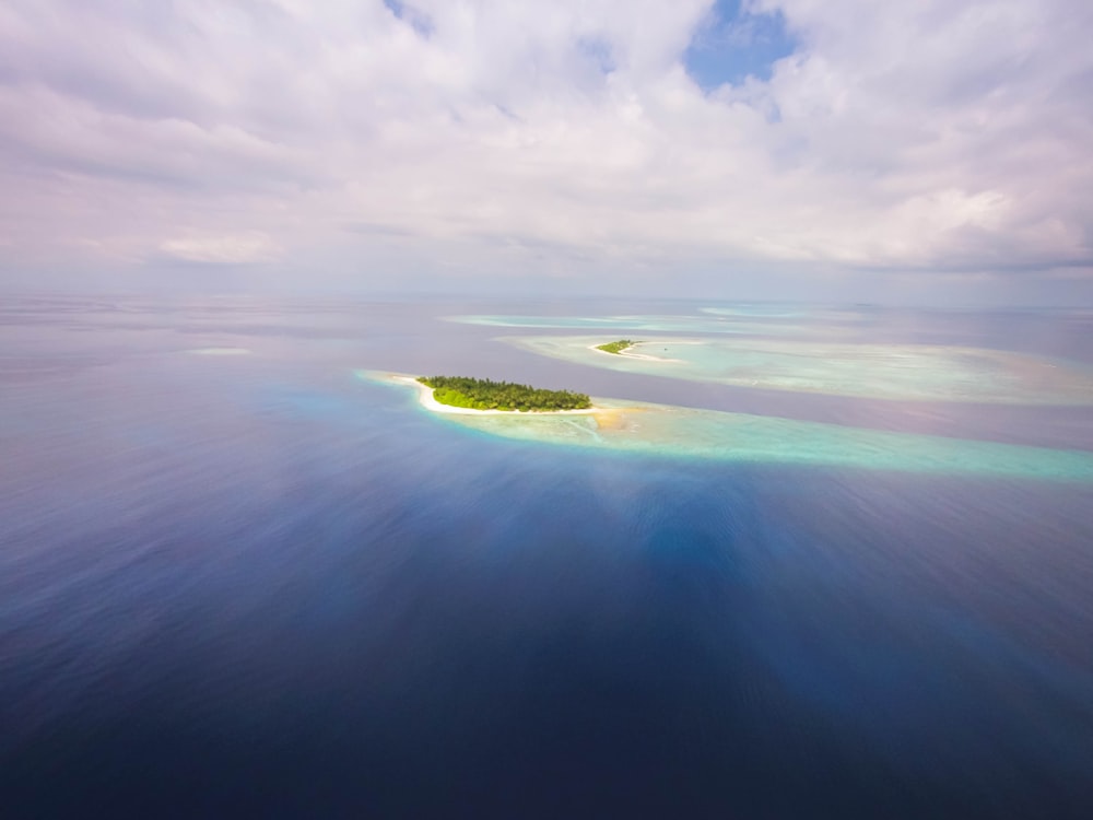 green island in the middle of ocean