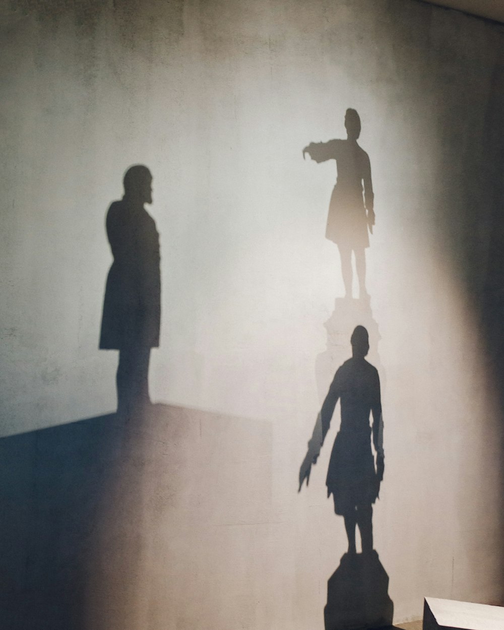 silhouette of man and woman walking on the street