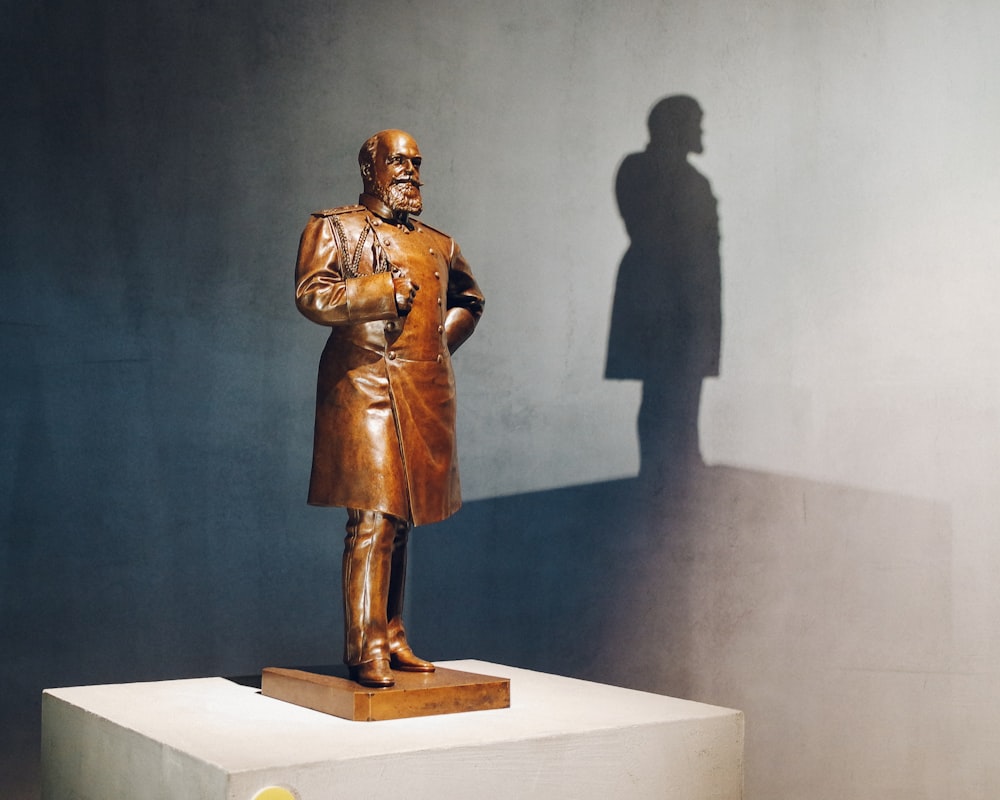 man and woman statue on white table