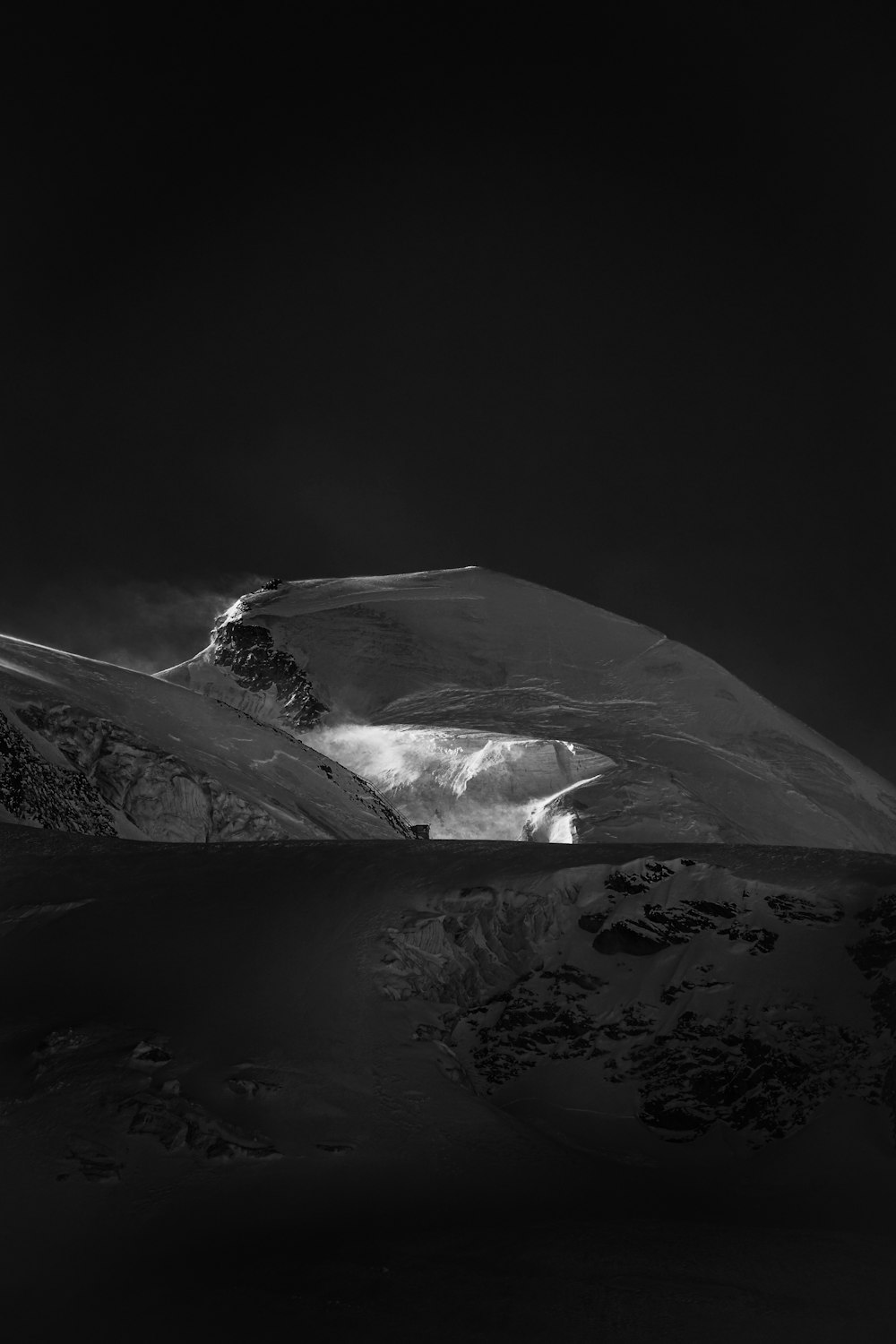 grayscale photo of snow covered mountain