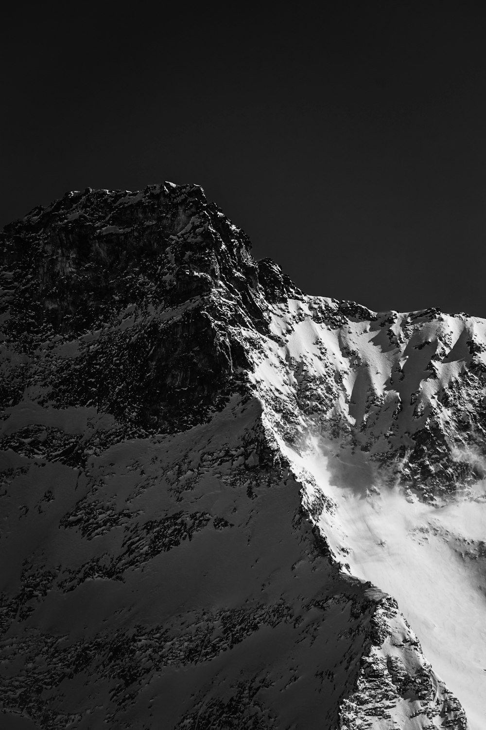 snow covered mountain during daytime