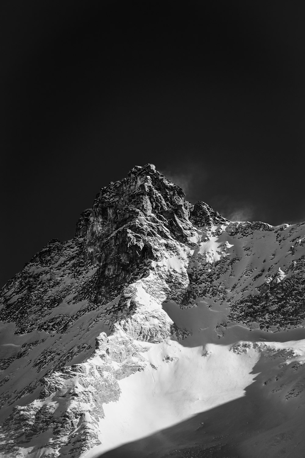 snow covered mountain during daytime