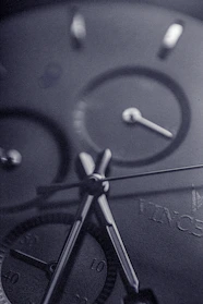 Close-up photo of a sleek aaa+ luxury watch with intricate dial details and polished metal finish