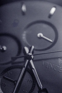 A close-up shot of a luxury wristwatch with intricate details and polished metal finish.