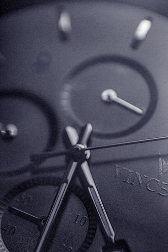 Close-up of a luxury watch face with intricate details and polished metal.