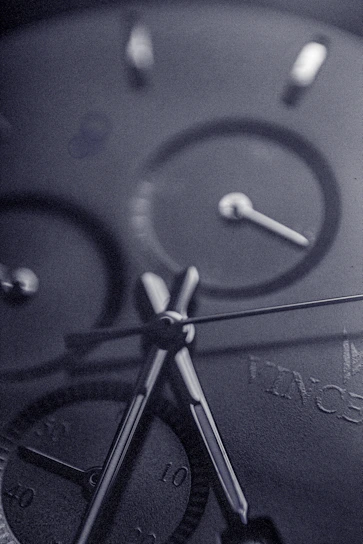 A close-up shot of a luxury wristwatch with intricate details and polished metal finish.