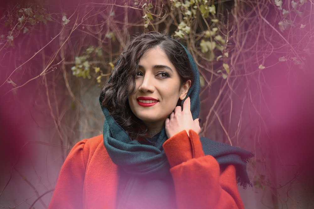 woman in pink long sleeve shirt and blue scarf