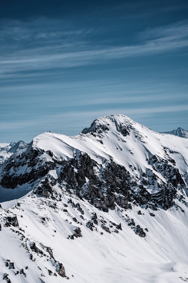 snow covered mountain under blue sky during daytime