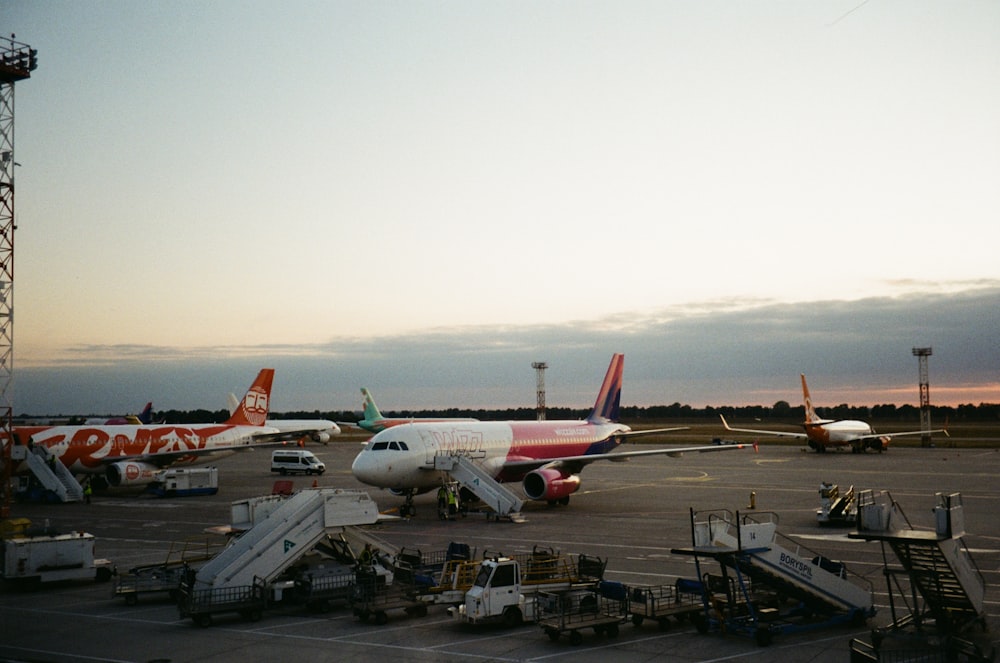 white and blue airplane on airport during daytime