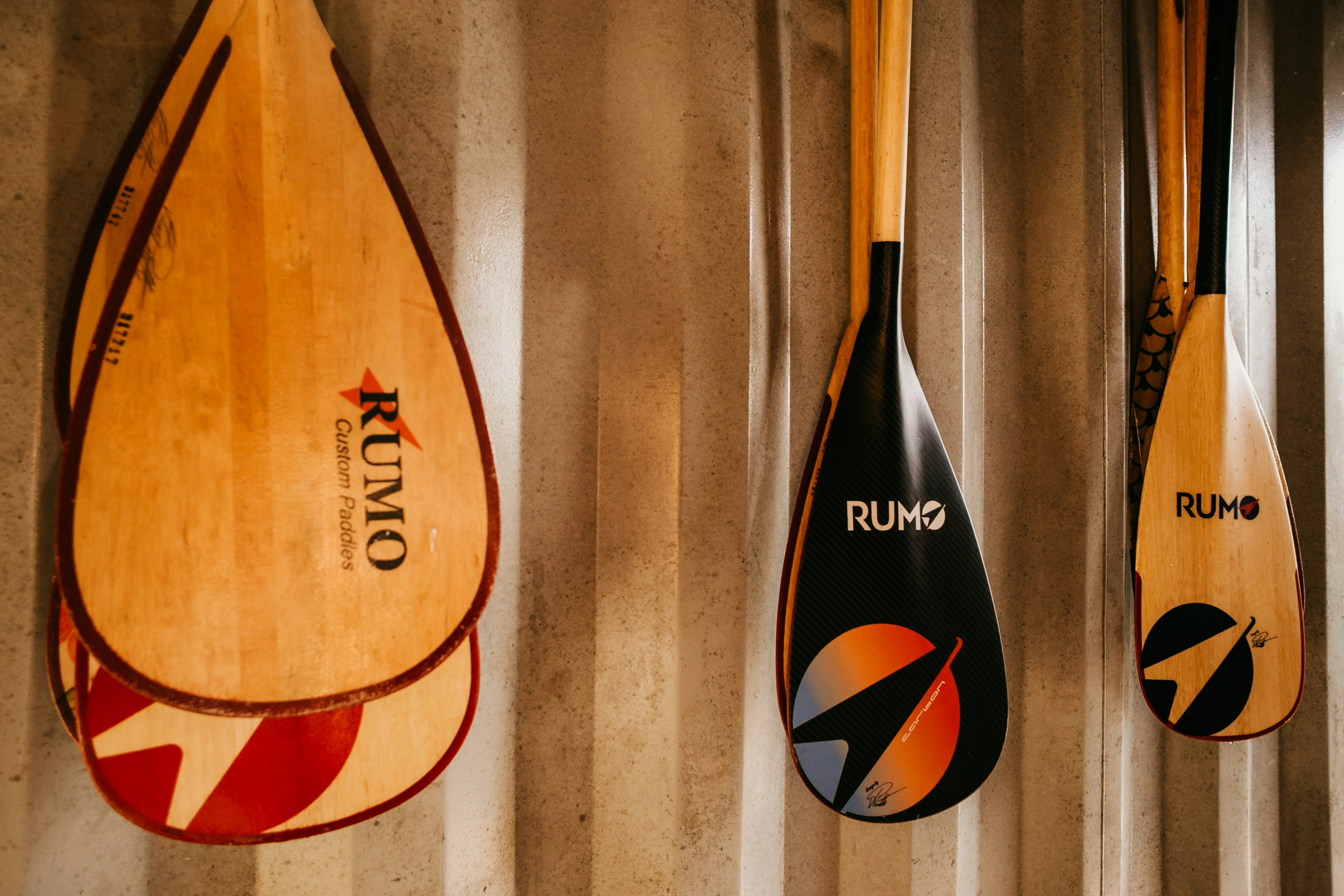 brown and black wooden surfboard