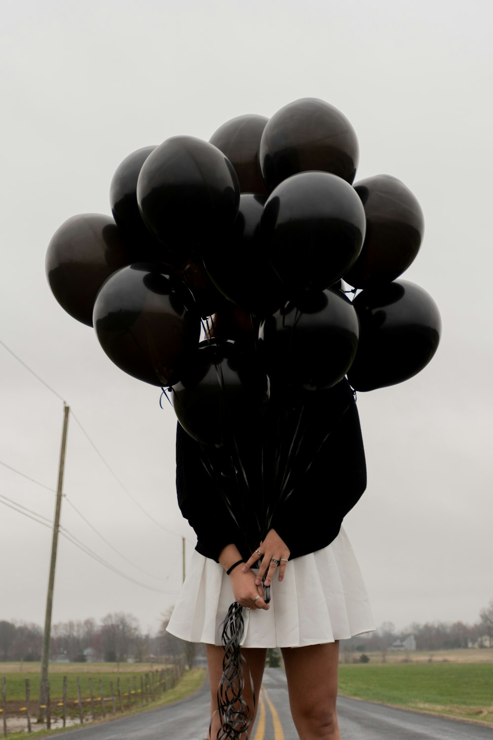 black balloons on mid air during daytime