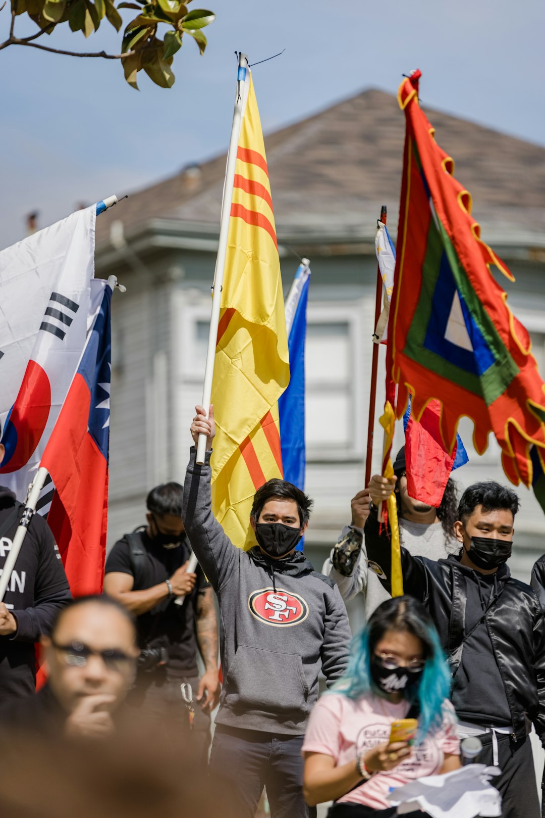 people holding flags during daytime