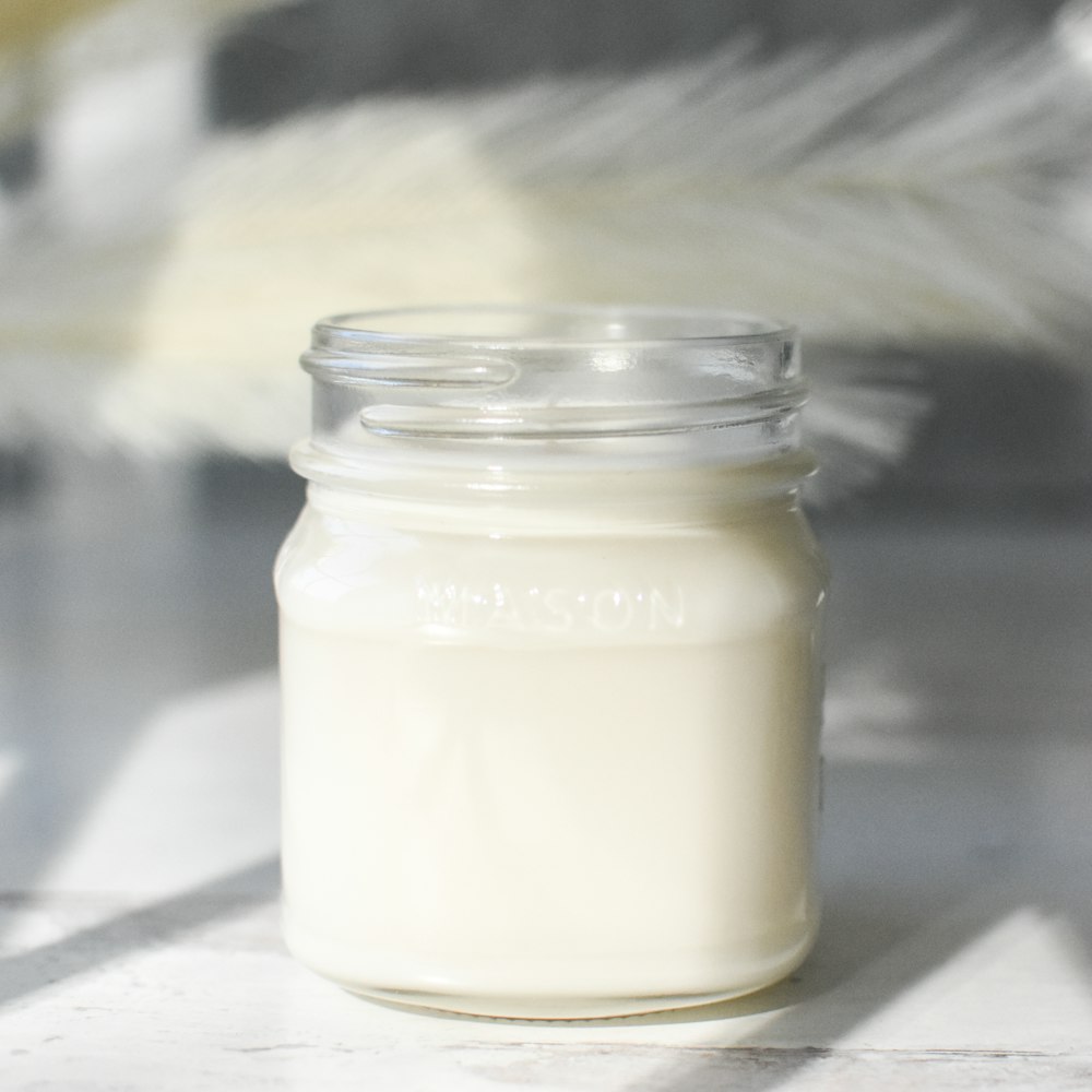 clear glass jar with white liquid