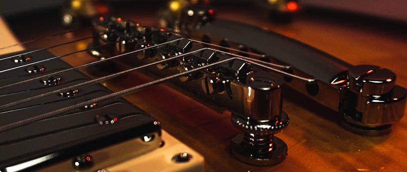 brown guitar headstock on brown wooden table