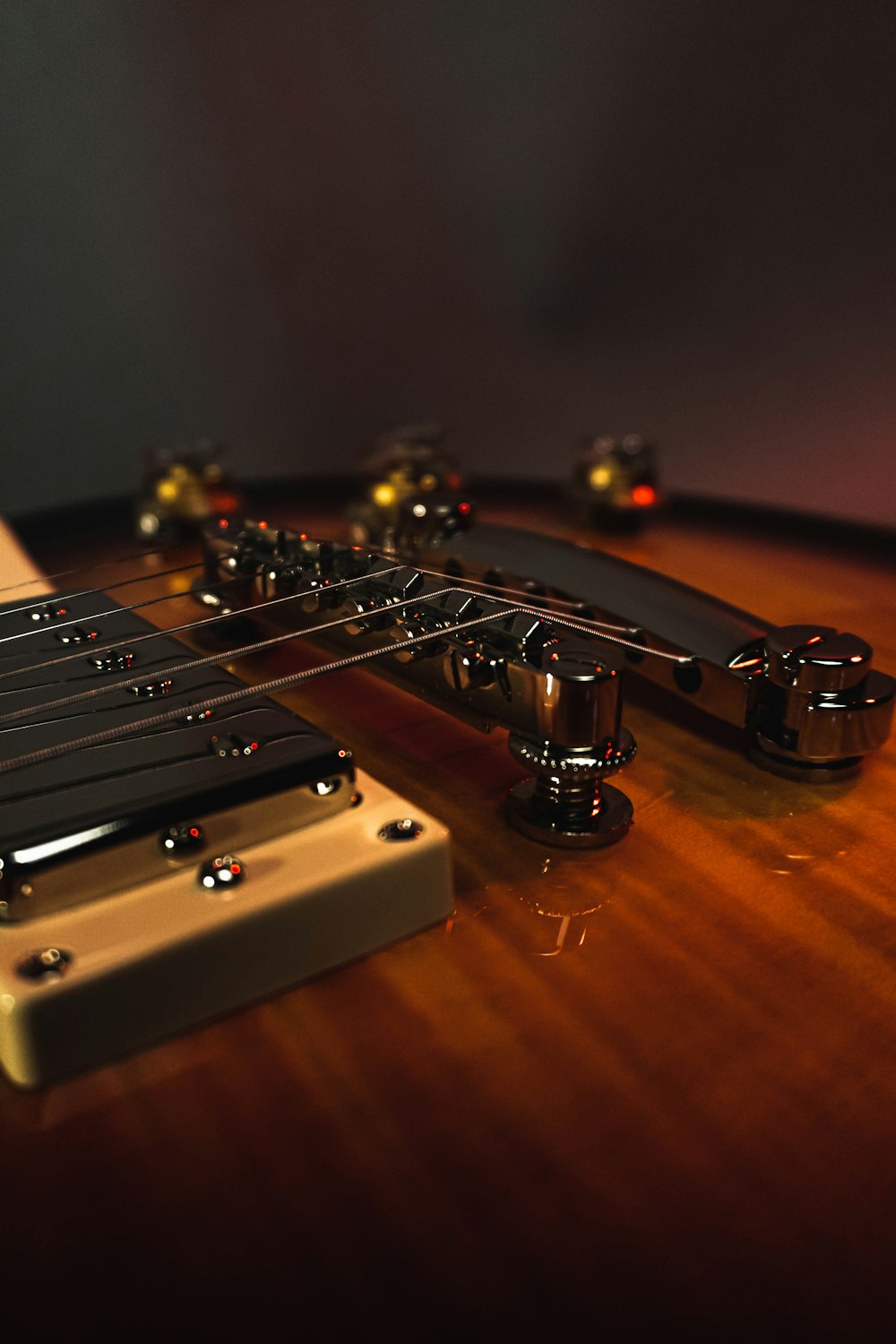 brown guitar headstock on brown wooden table